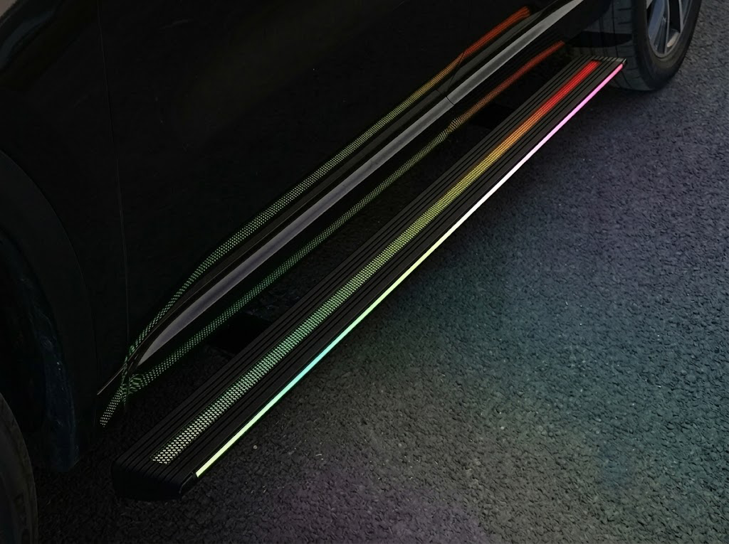 Illuminated electric side step